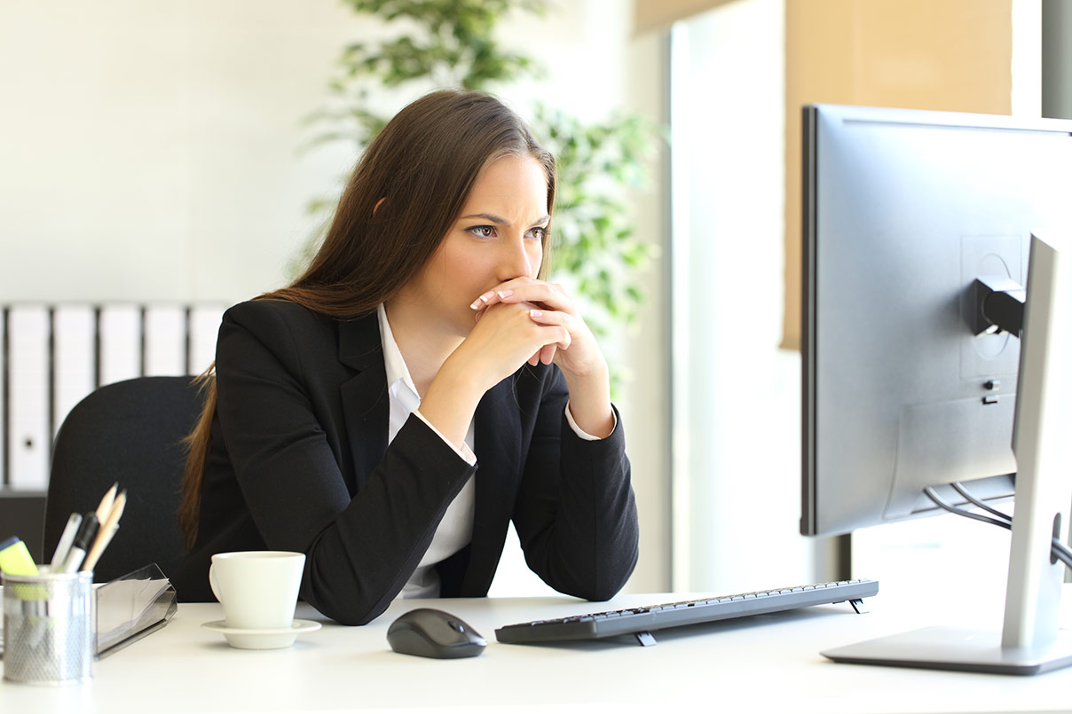 woman analyzing finances on computer