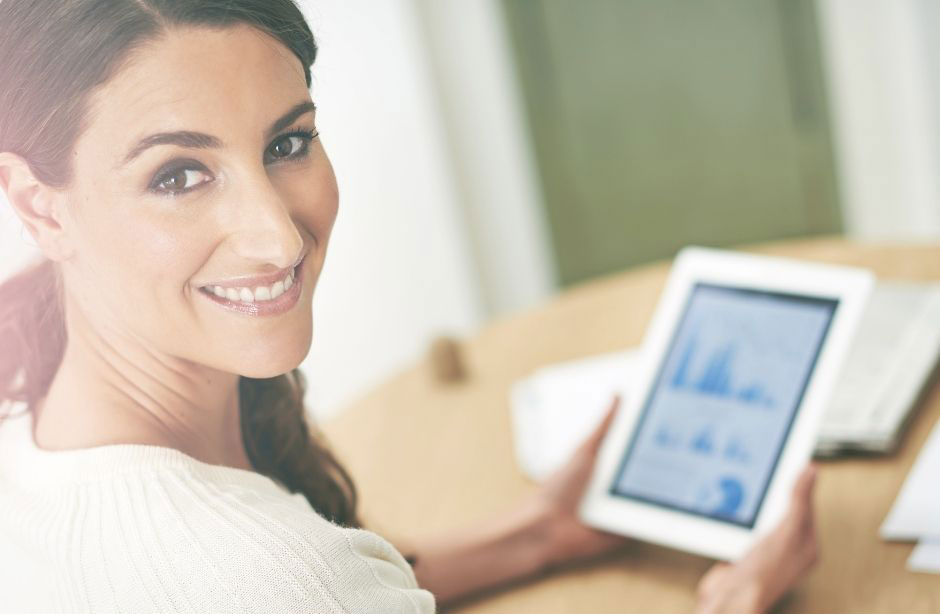 smiling woman on tablet