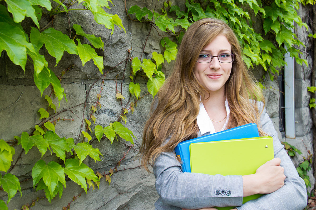 university student carrying books